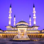 gold mosque during night time