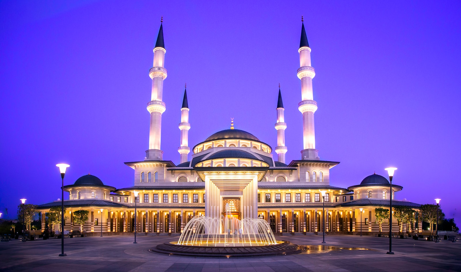 gold mosque during night time